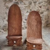 Pair of hand-carved wooden folding chairs – African origin, animal and face motifs, mid-20th century