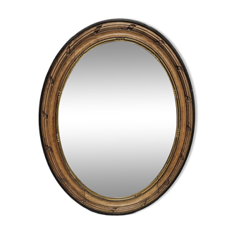 carved oval mirror