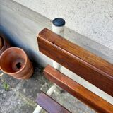 Bench in dark wood and white metal