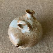 Small sandstone goat in the style of marsh sandstone or hot air balloon