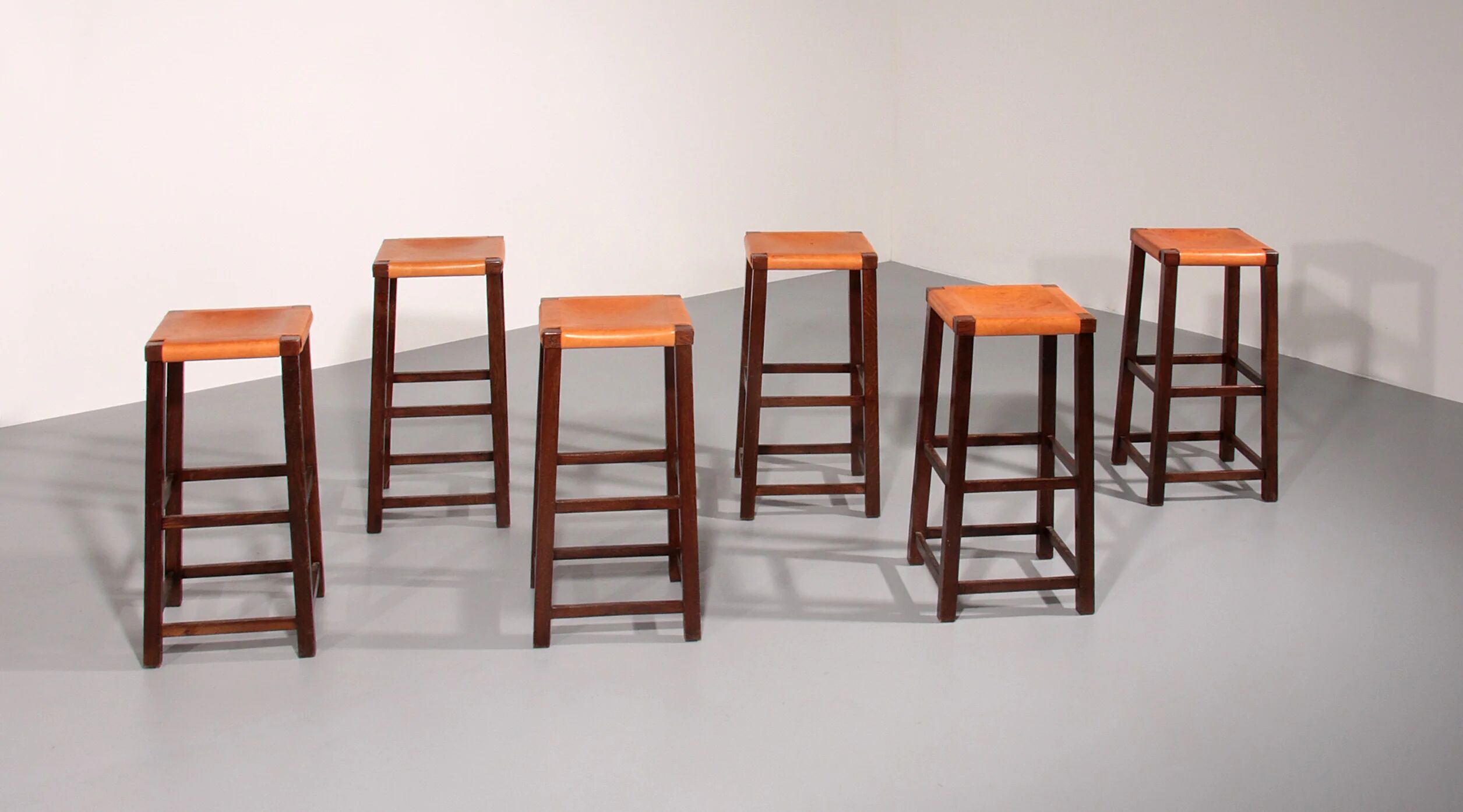 Mid-century oak bar stools with cognac leather seats