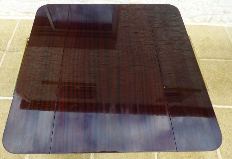 Chic serving table on wheels from the 60s with brass decorations and two shelves.