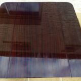 Chic serving table on wheels from the 60s with brass decorations and two shelves.