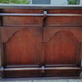 Bar counter in solid exotic teak wood; molded panel decor.