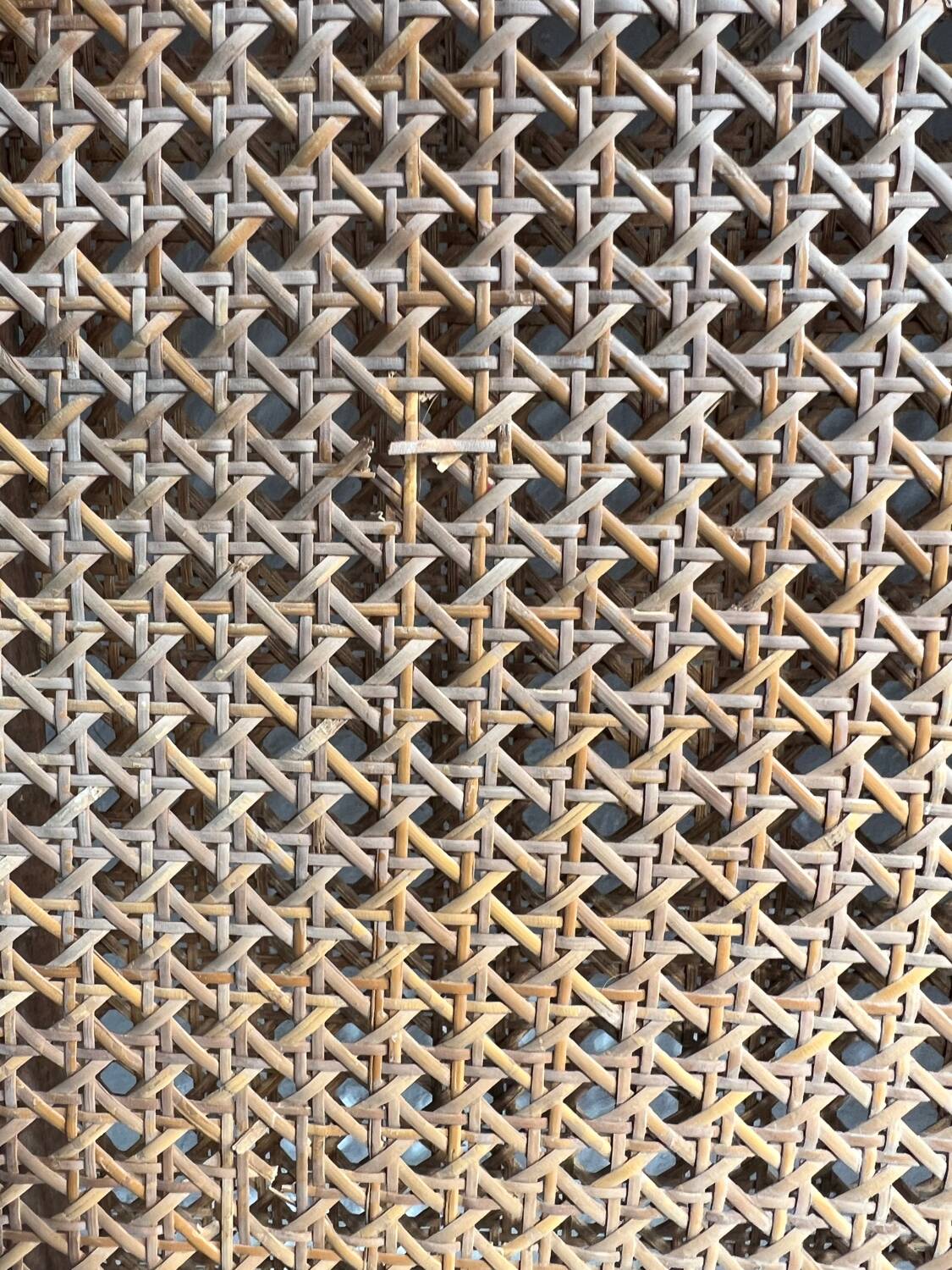 Old wooden and cane bed