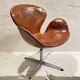 First edition Arne Jacobsen Swan chair, original patinated leather, 1950s