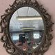 Miroir en bronze à volutes style rocaille