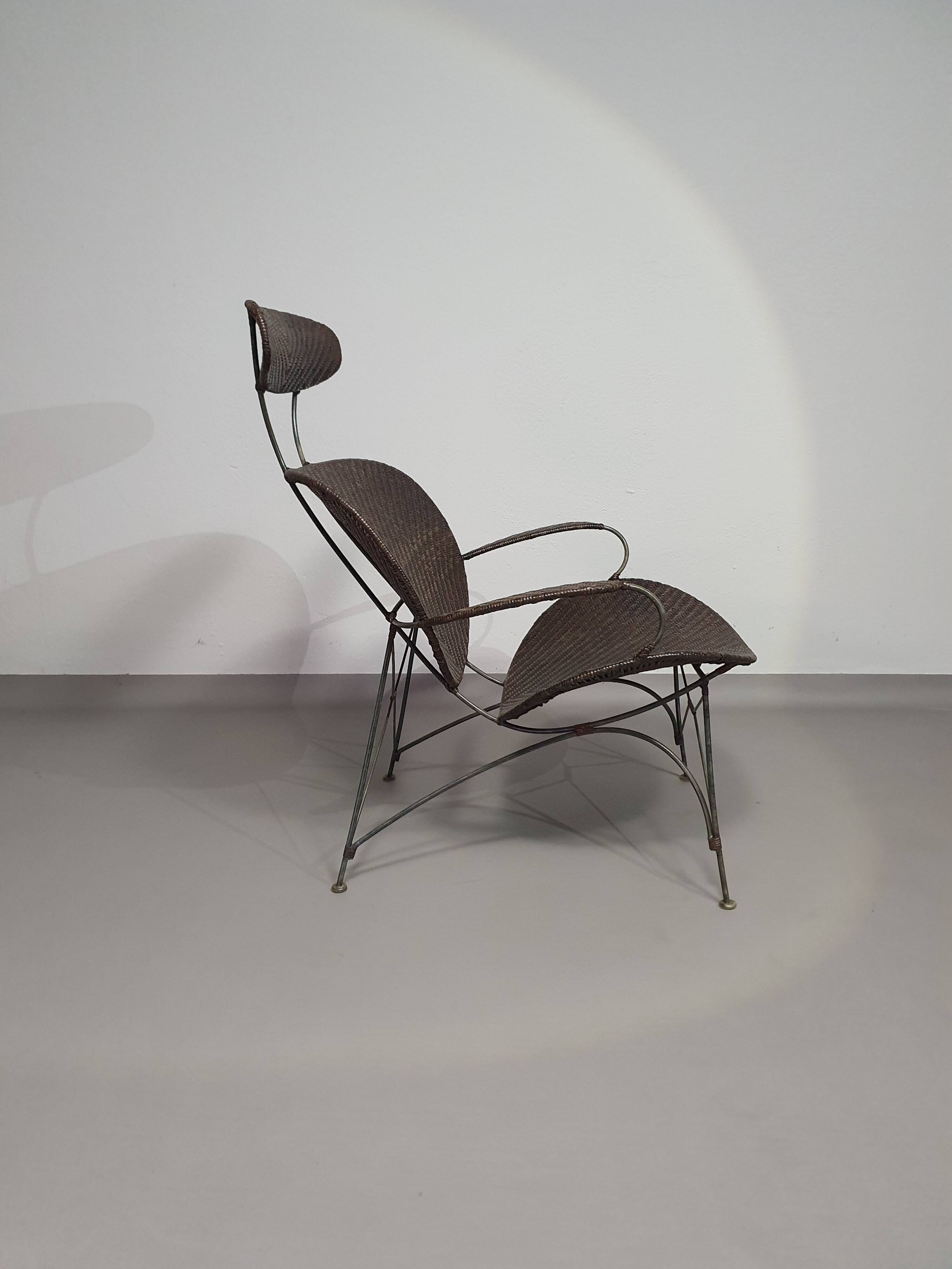 Armchair designed by Yuzuru Yamakawa  Metal frame.  Seat and back in braided rattan.