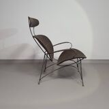 Armchair designed by Yuzuru Yamakawa  Metal frame.  Seat and back in braided rattan.