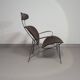 Fauteuil conçu par Yuzuru Yamakawa Structure en métal. Assise et dossier en rotin tressé.