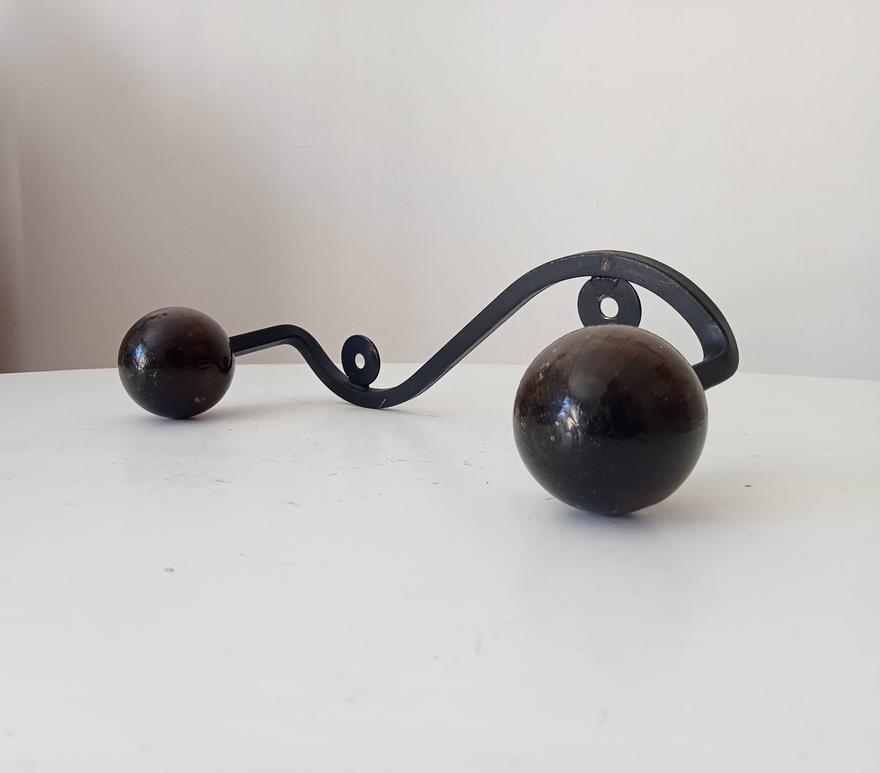 Wood and wrought iron ball coat rack from the 1950s.
