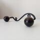 Wood and wrought iron ball coat rack from the 1950s.