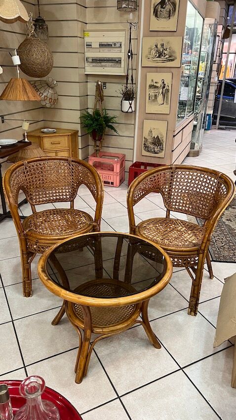 Rattan living room and cannage consisting of 2 armchairs and a coffee table