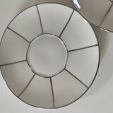 Two Art Deco porcelain cups and saucers with silver trim.