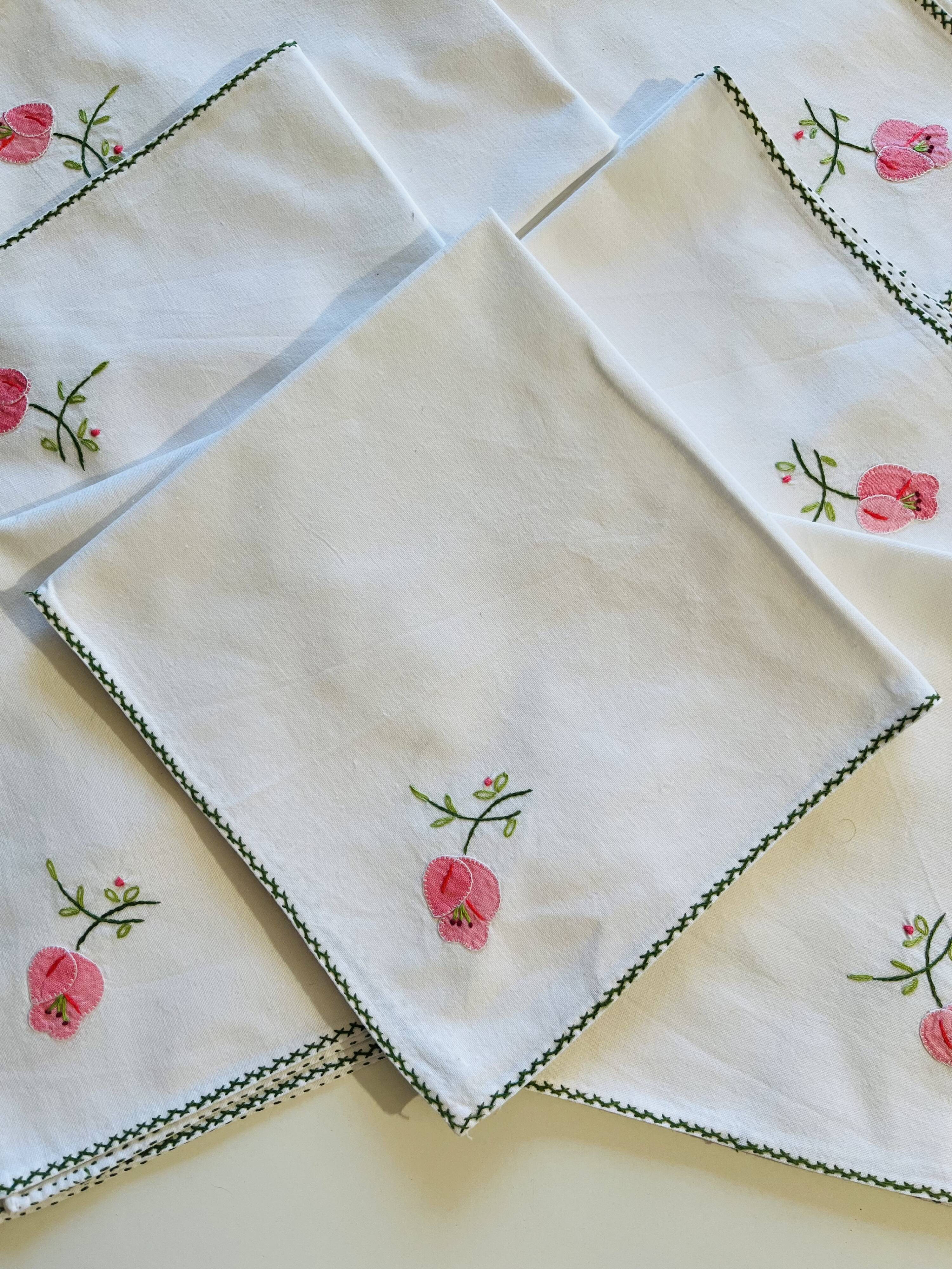 Set of 12 vintage hand-embroidered cotton white napkins.