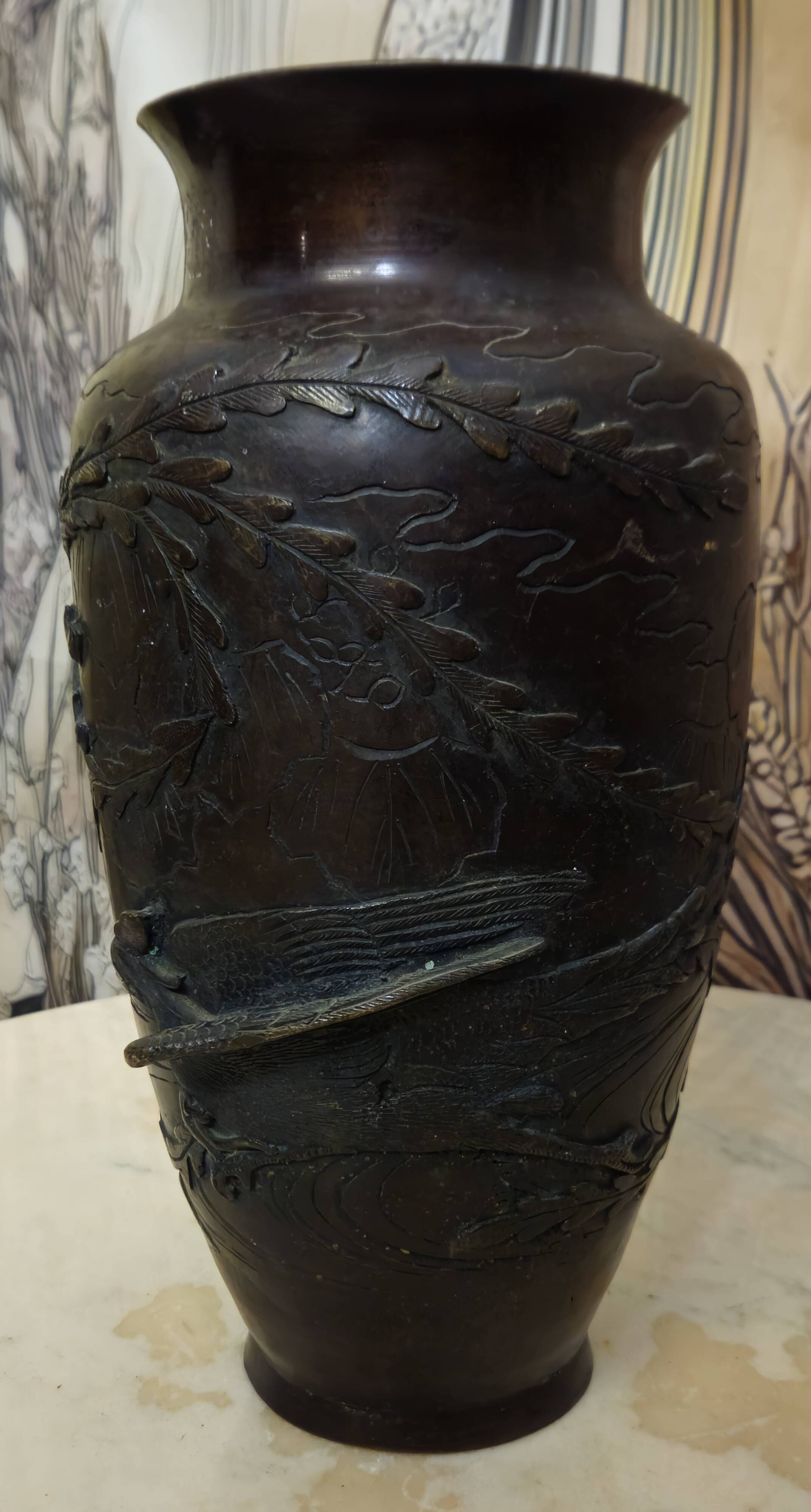 Patinated bronze vase with relief decoration