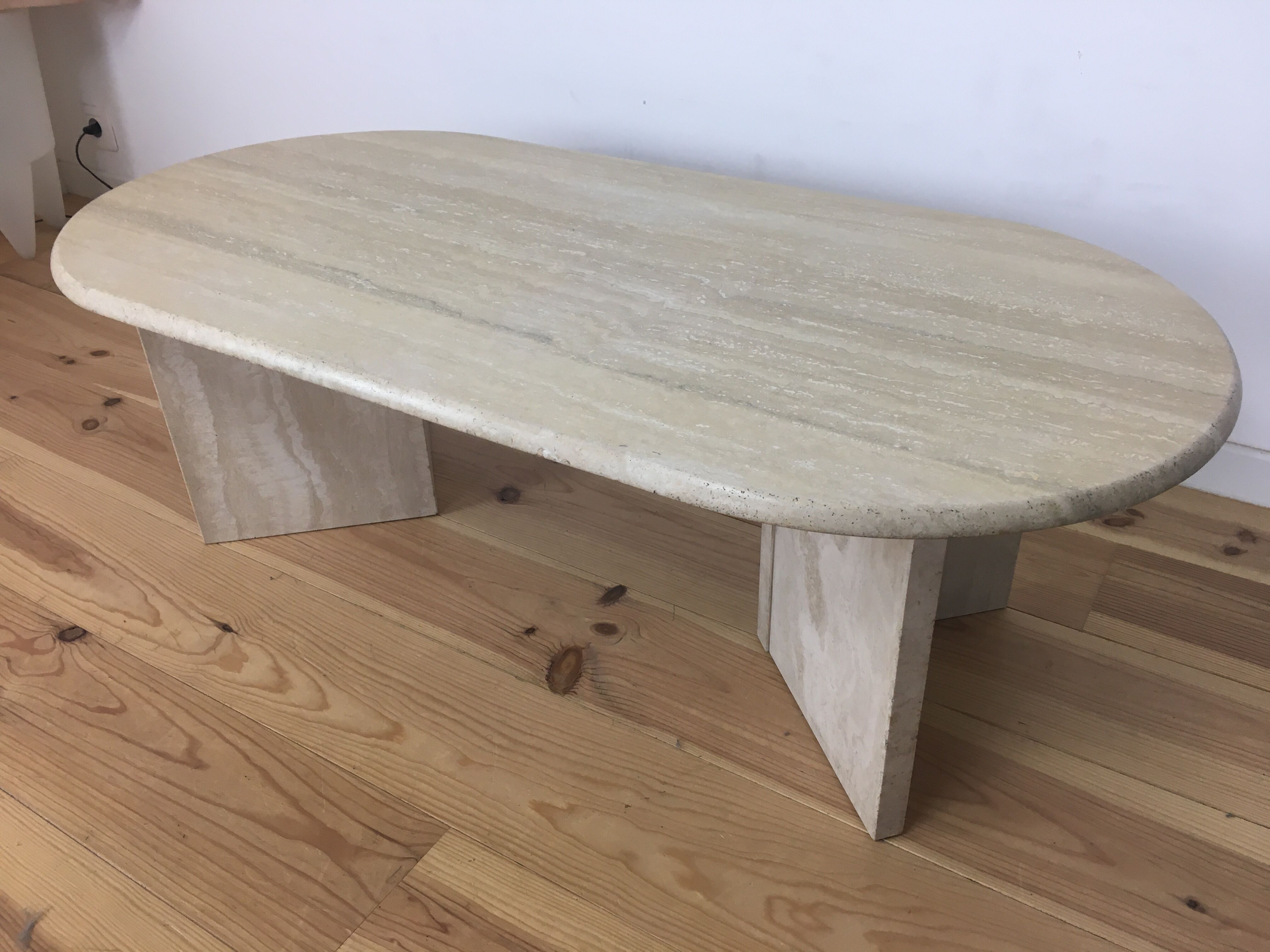 Oval coffee table in travertine