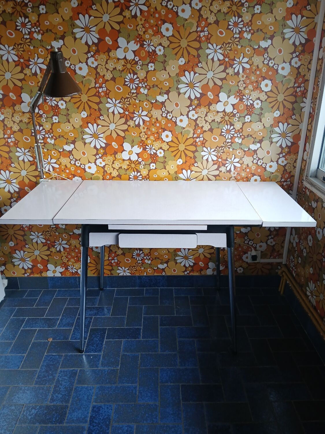 Extendable formica table and vintage 1960s chairs.
