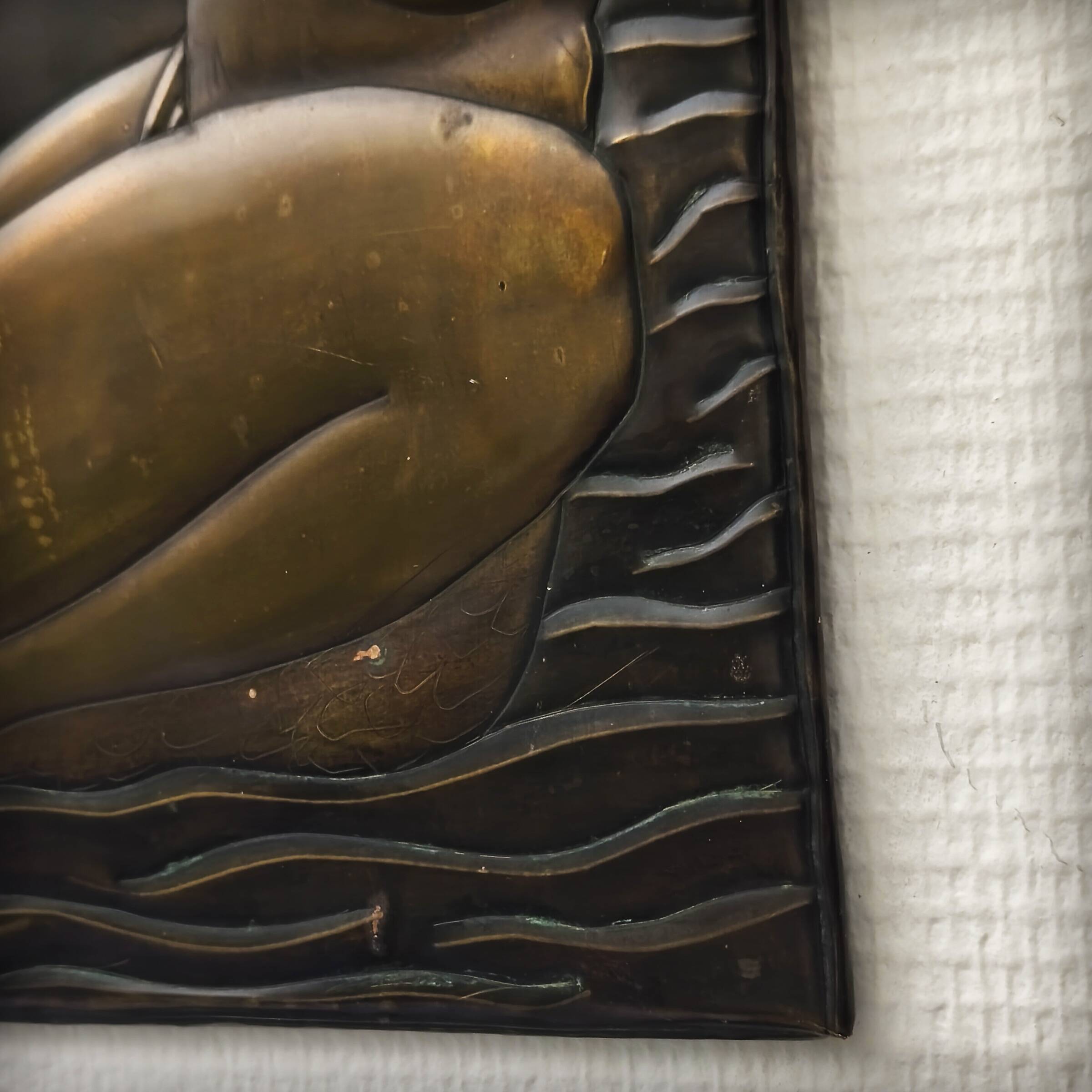 Brass table featuring a woman and a dolphin, France, 1960s.