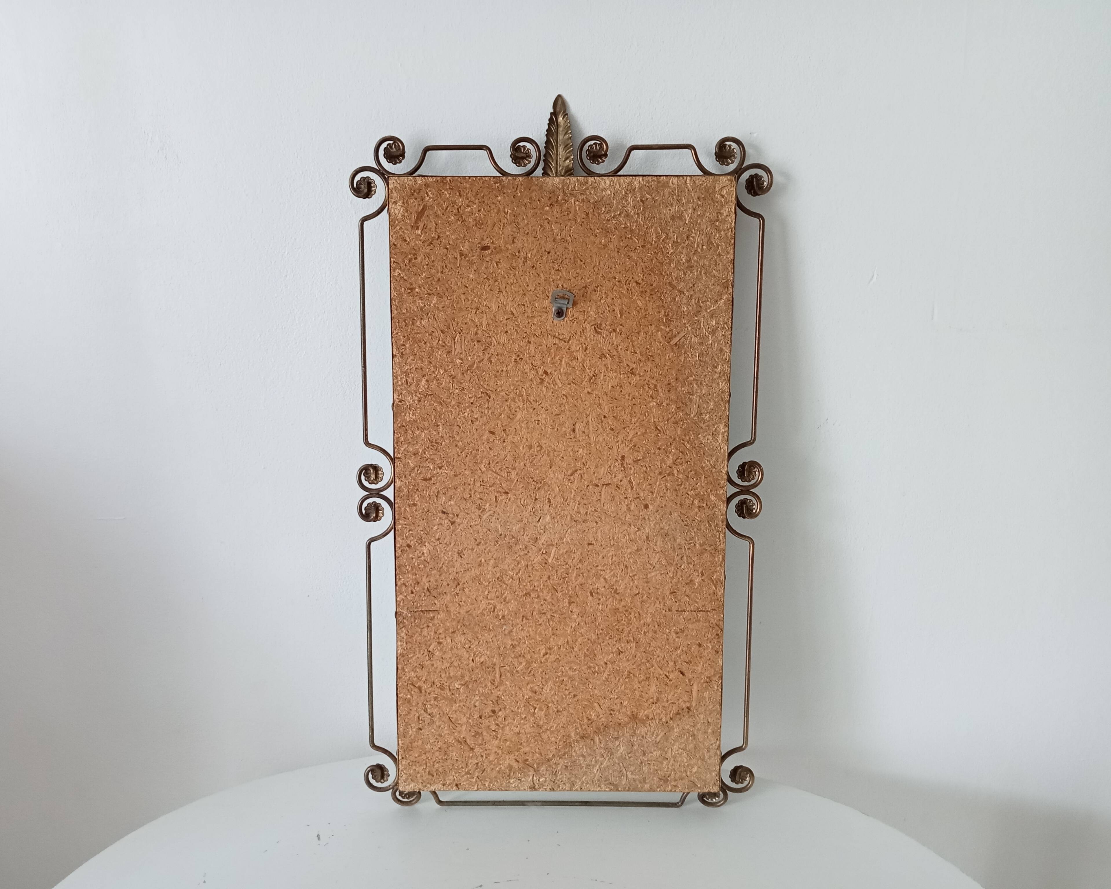 Vintage Hollywood Regency mirror from the 1950s.
