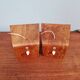 Pair of Philips teak and opaline wall lights, designed by Louis Kalff, 1950
