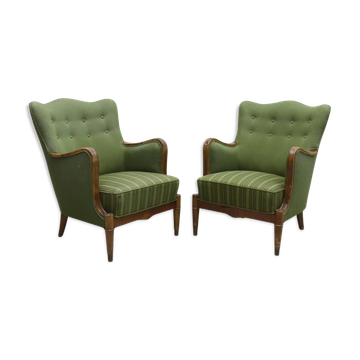 Modern Danish armchairs by Alfred Christensen. Beautiful shape, brass legs.