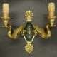 Pair of Empire style wall sconces with swans by Petitot - bronze & green patina