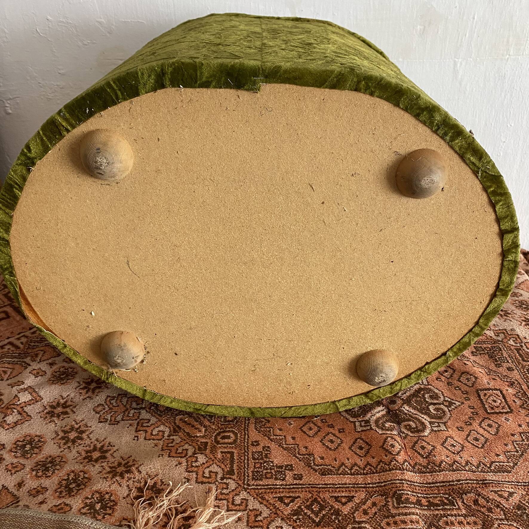 Green velvet storage pouffe from the 1960s.
