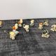 Set of 11 miniature birds in polychrome glazed ceramic.
