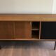 Sideboard with double sliding doors and bar on a metal base
