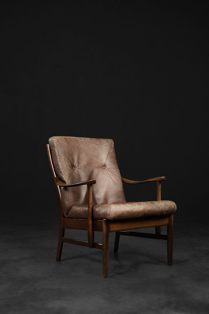 Modern vintage Danish armchair in beech and brown leather by Farstrup Møbler, 1970.
