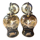 Pair of vintage wall sconces in brass with amber glass globes.
