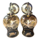 Pair of vintage wall sconces in brass with amber glass globes.