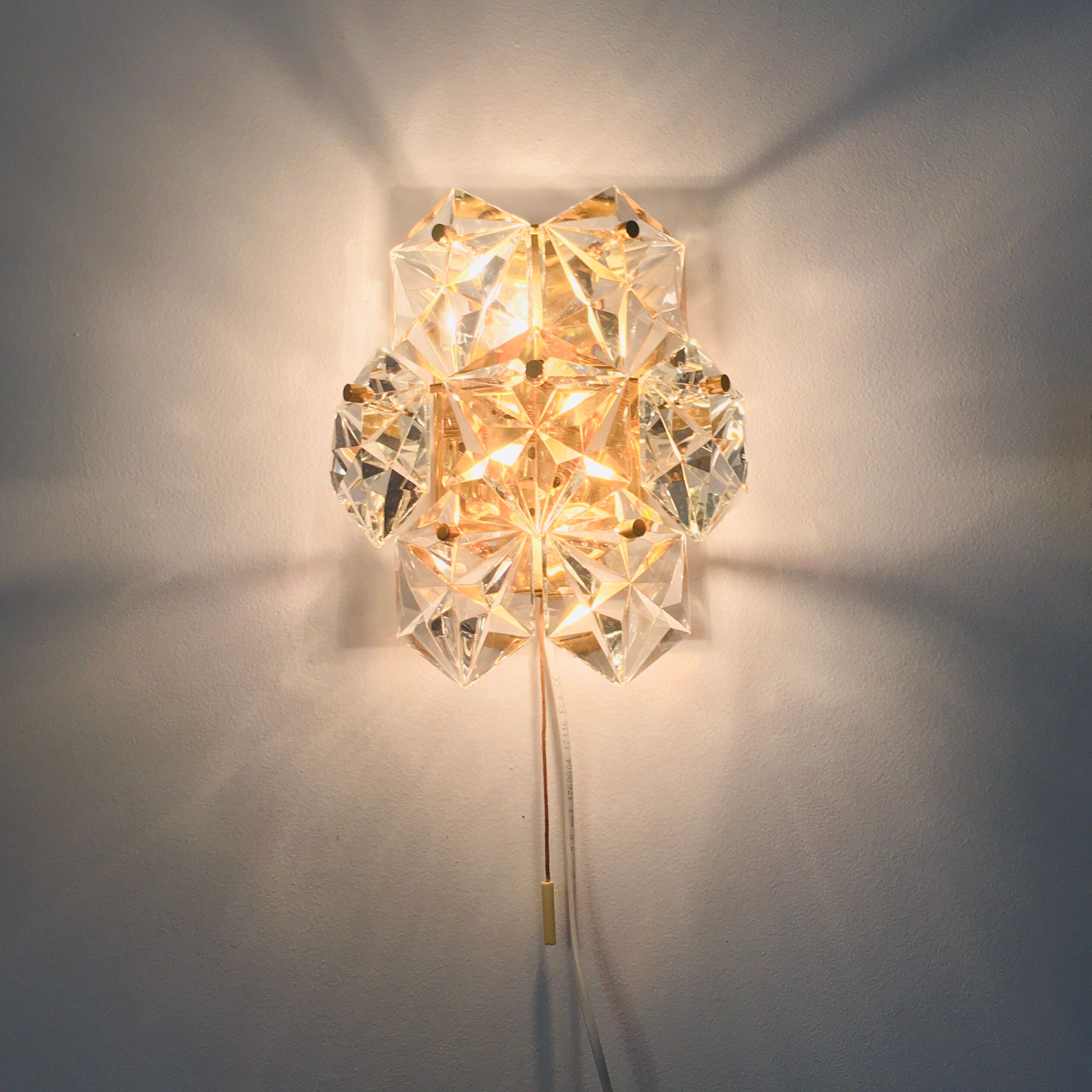 Pair of faceted crystal wall lights / sconces by Kinkeldey, Germany, 1970s