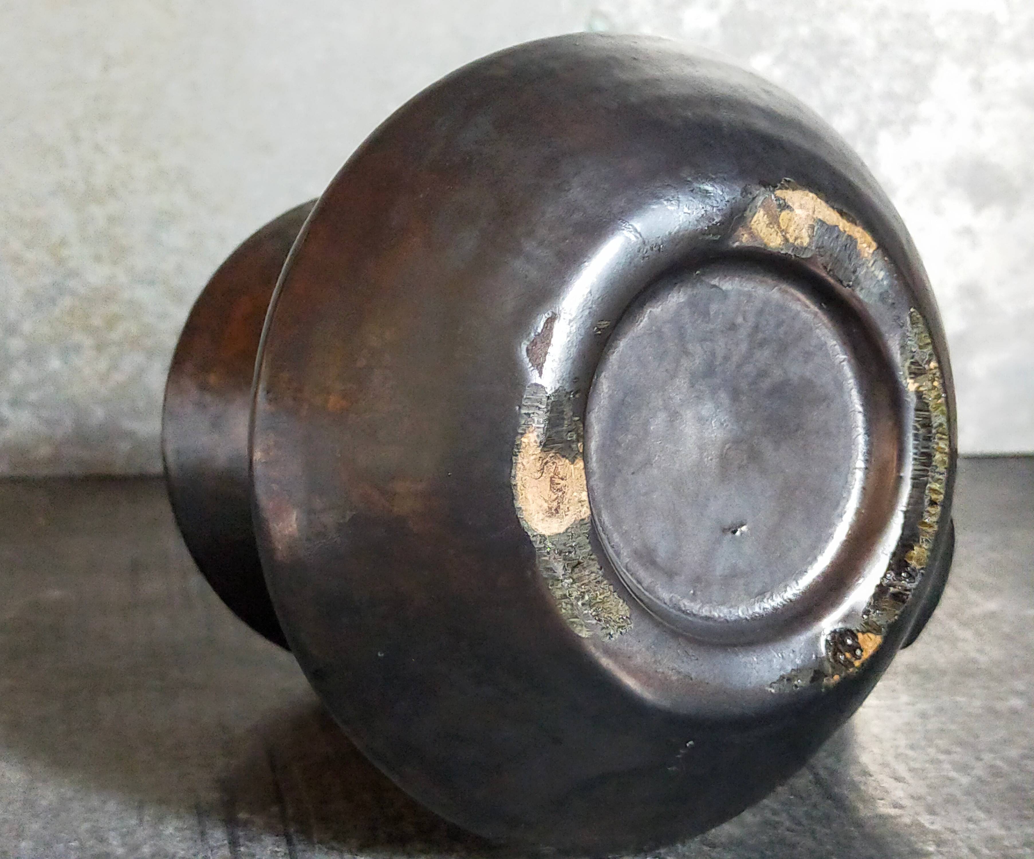 1950s iridescent black ceramic hand candle holder