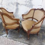 Pair of armchairs basket louis XV in carved walnut