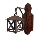 Wall lamp in wrought iron and old wood