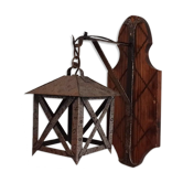 Wall lamp in wrought iron and old wood