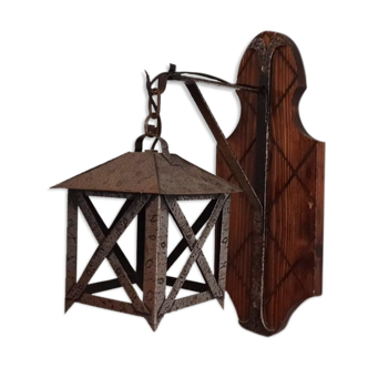 Wall lamp in wrought iron and old wood