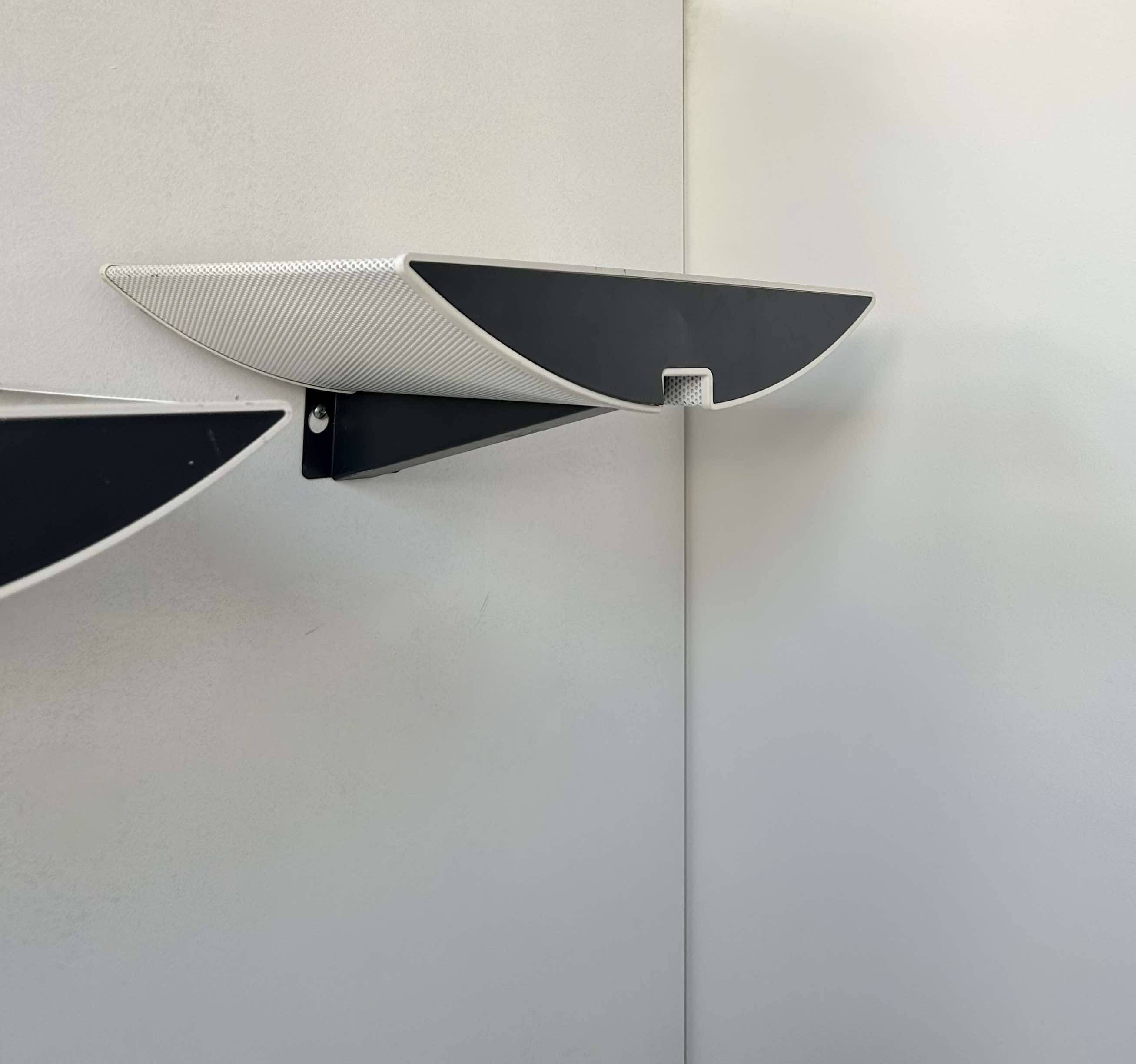 Pair of modernist wall lights, black and white lacquered metal, Italy 1980