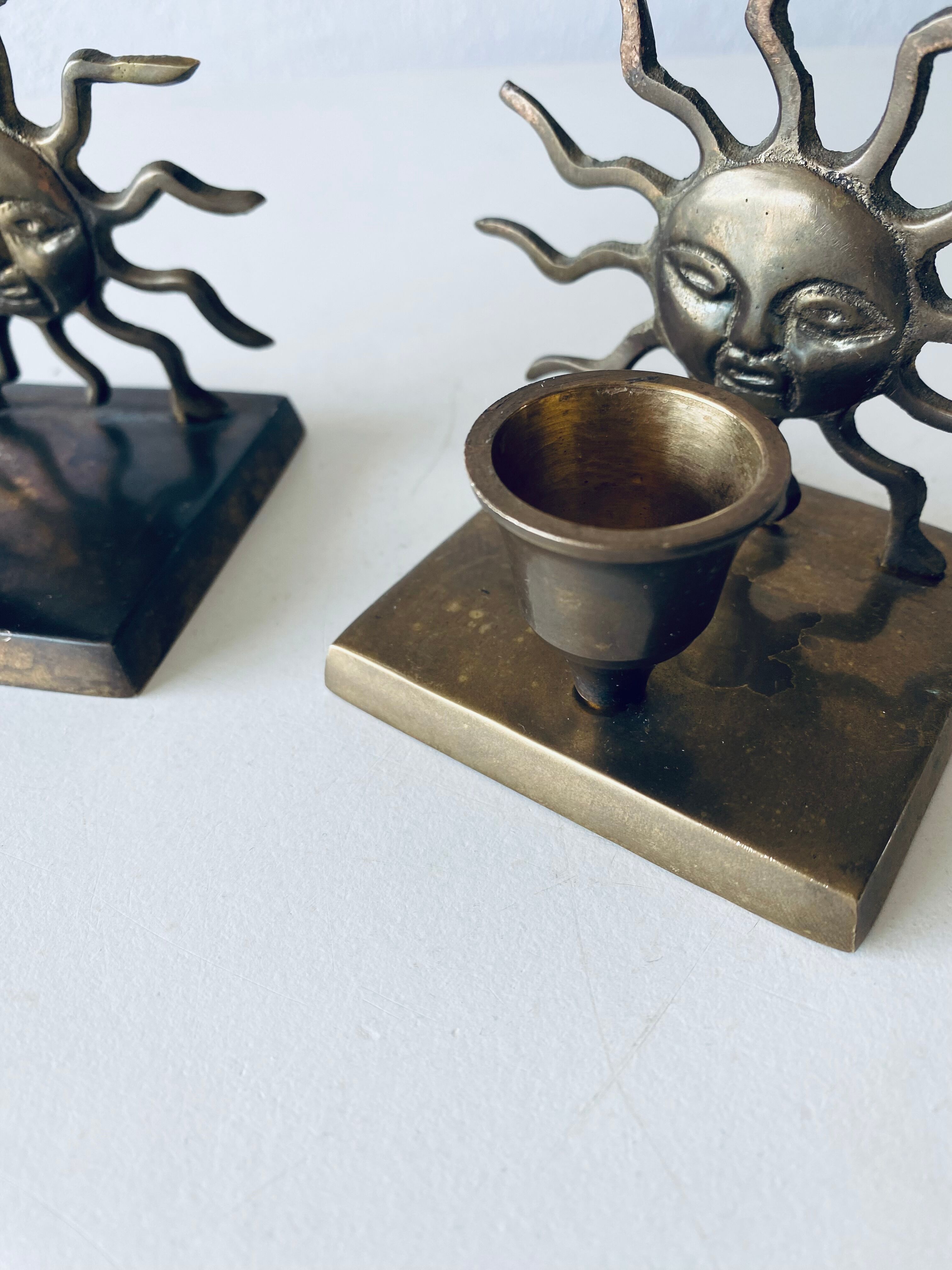 Pair of sun candle holders