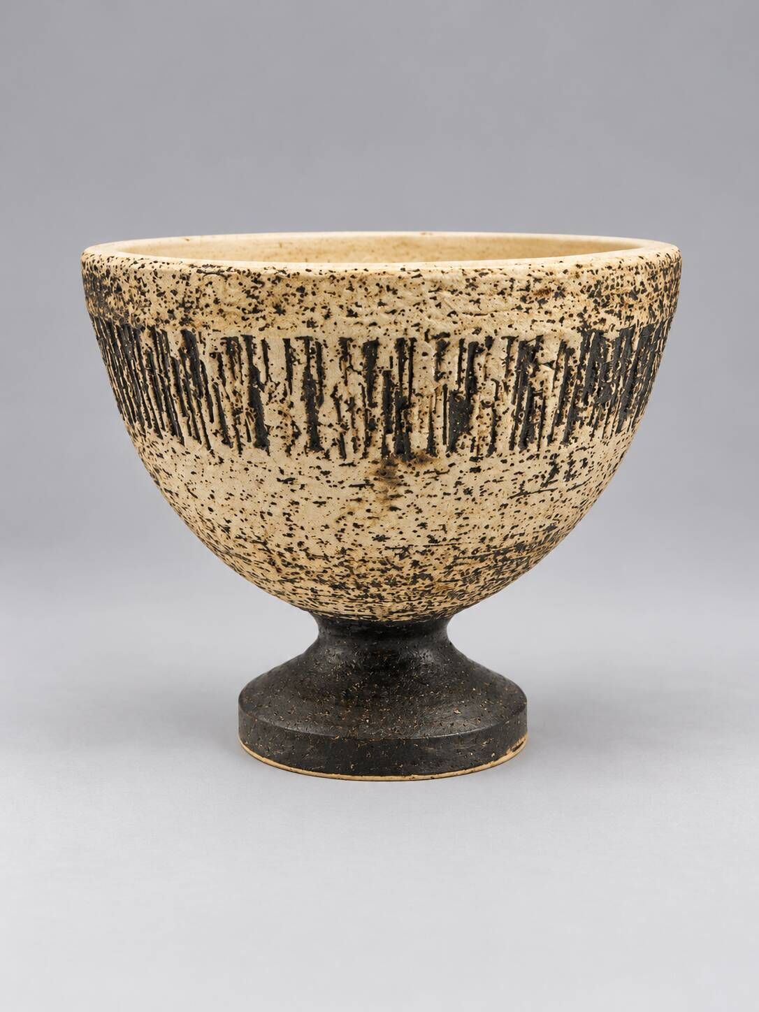 Vintage ceramic pedestal bowl – textured black and beige decor