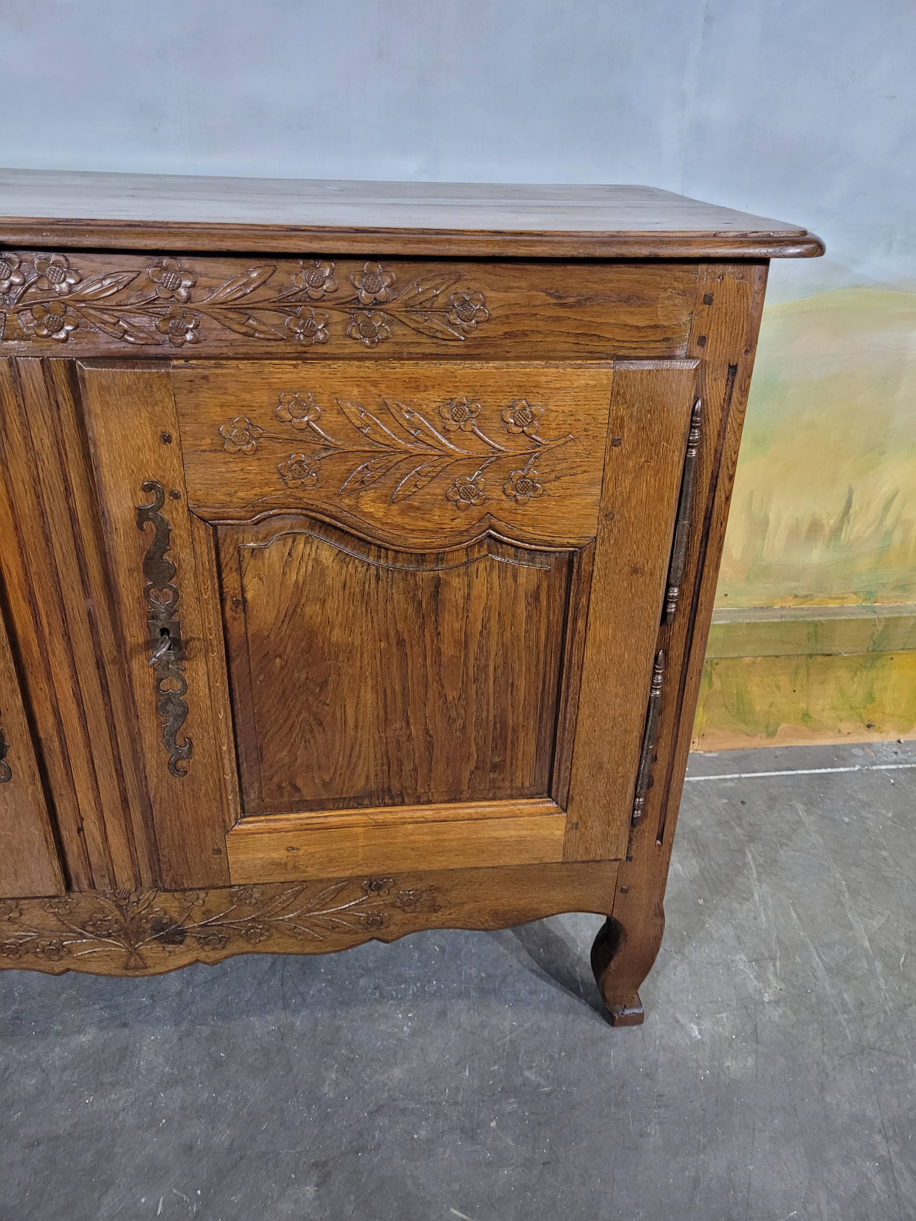 Low Norman sideboard carved in 19th century oak