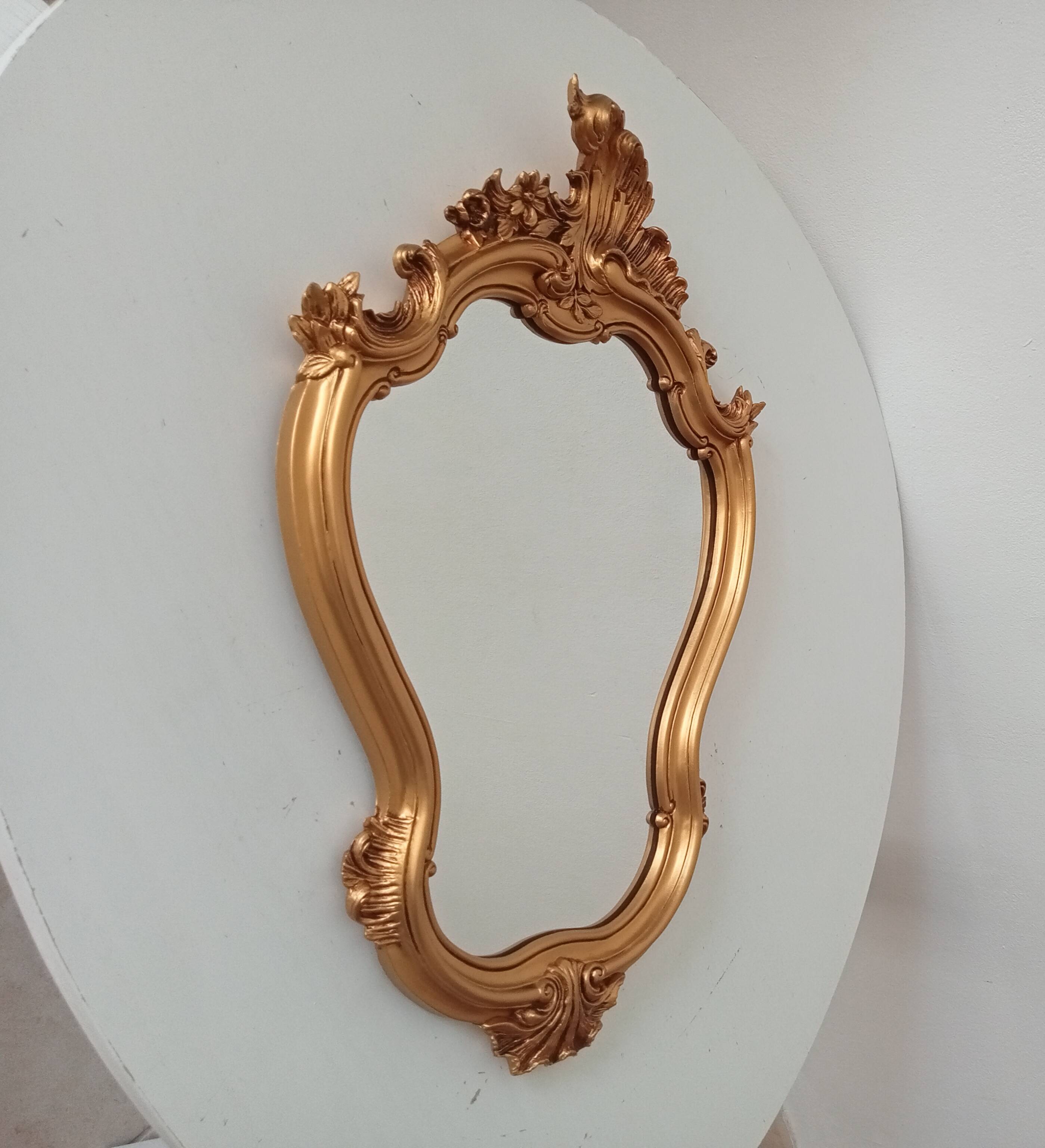 Vintage rococo mirror in gilded resin