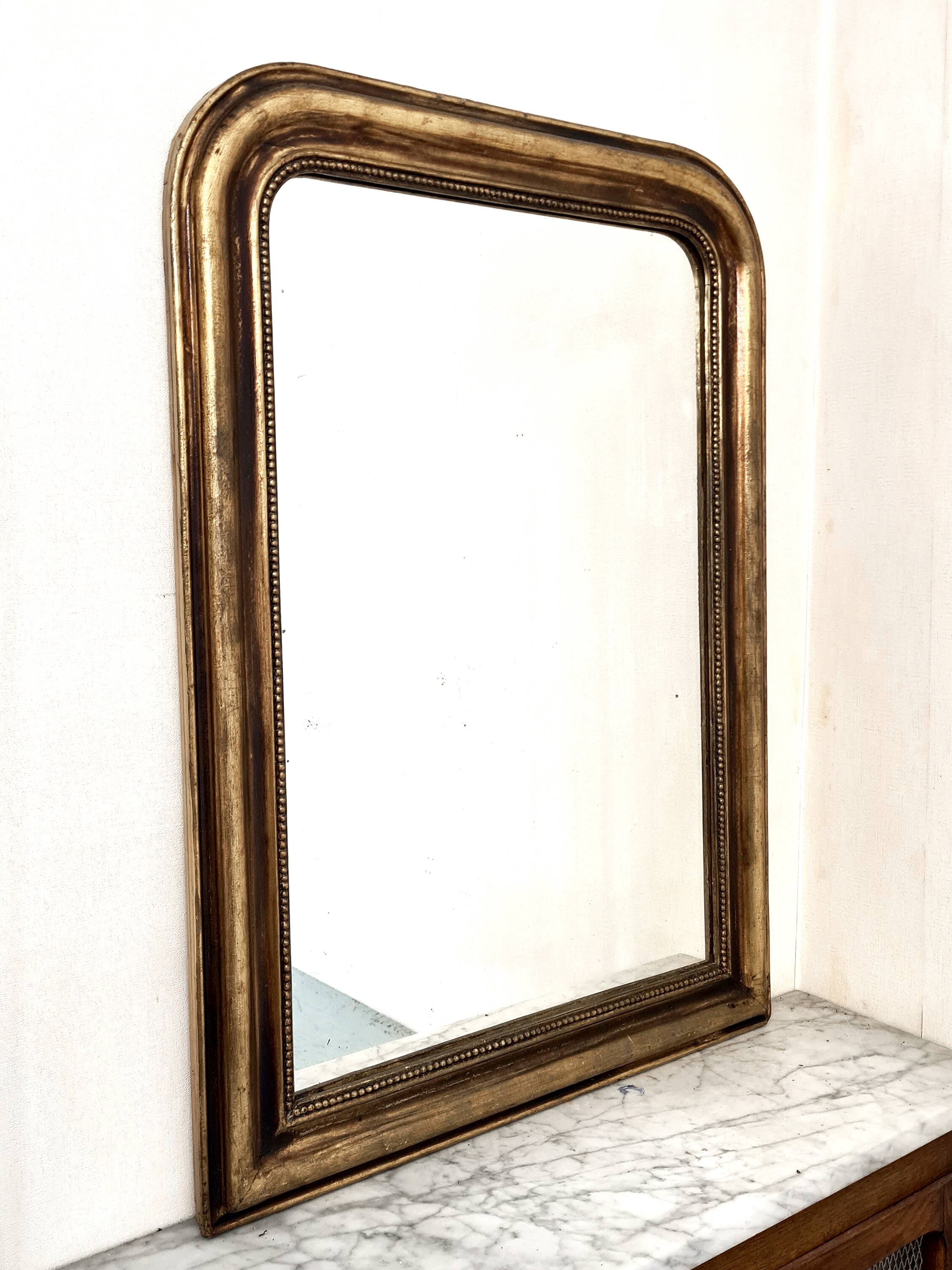 Antique Louis-Philippe gilded mirror “Apoline”