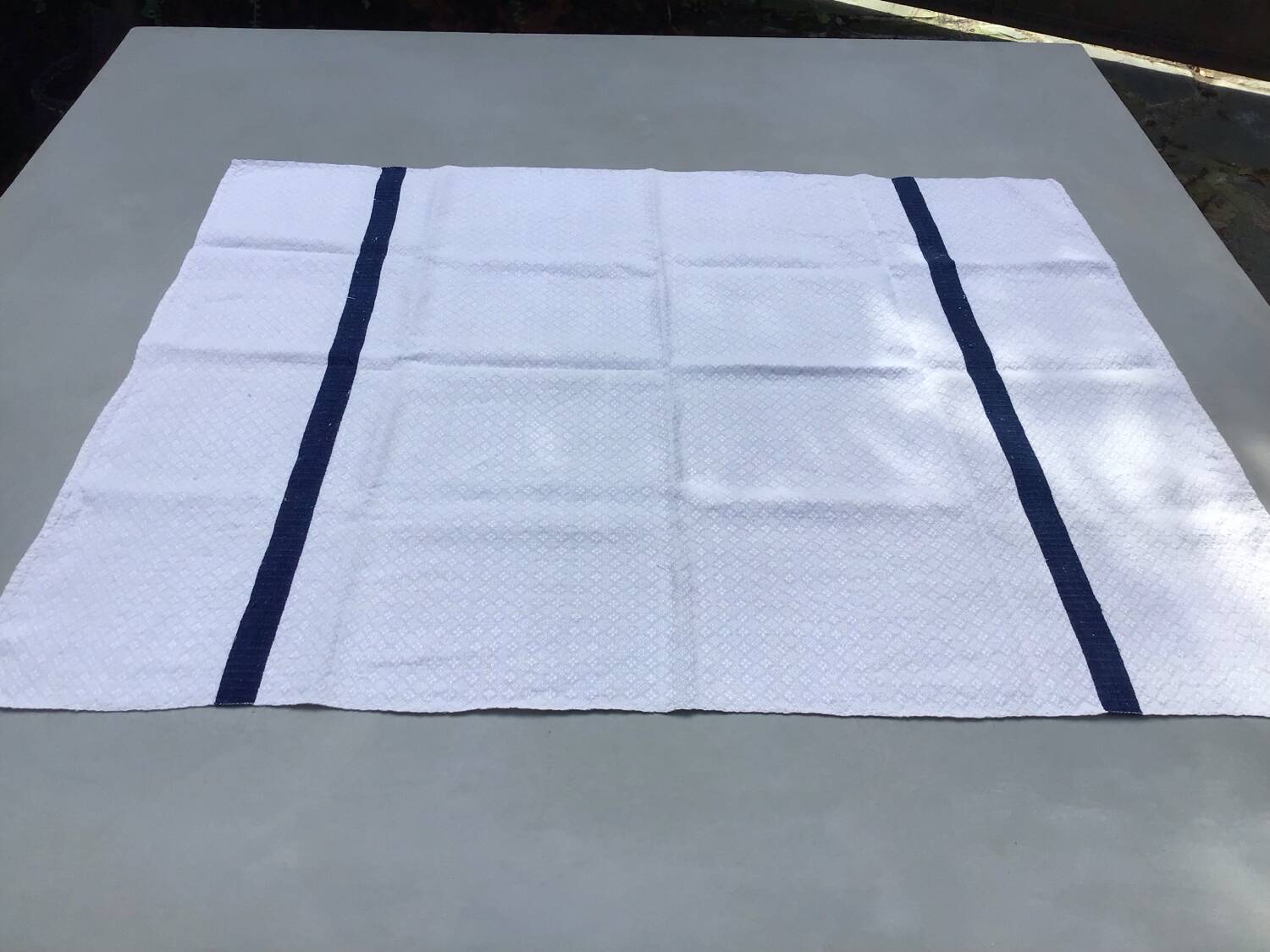 Old ecru Basque linen tea towel with navy blue stripes