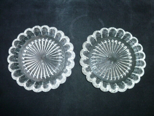 Pair of 2 cast pressed glass bottles