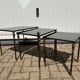 Nested tables in gilded brass in the style of Maison Charles.