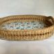 Old wicker basket tray with wooden beads.