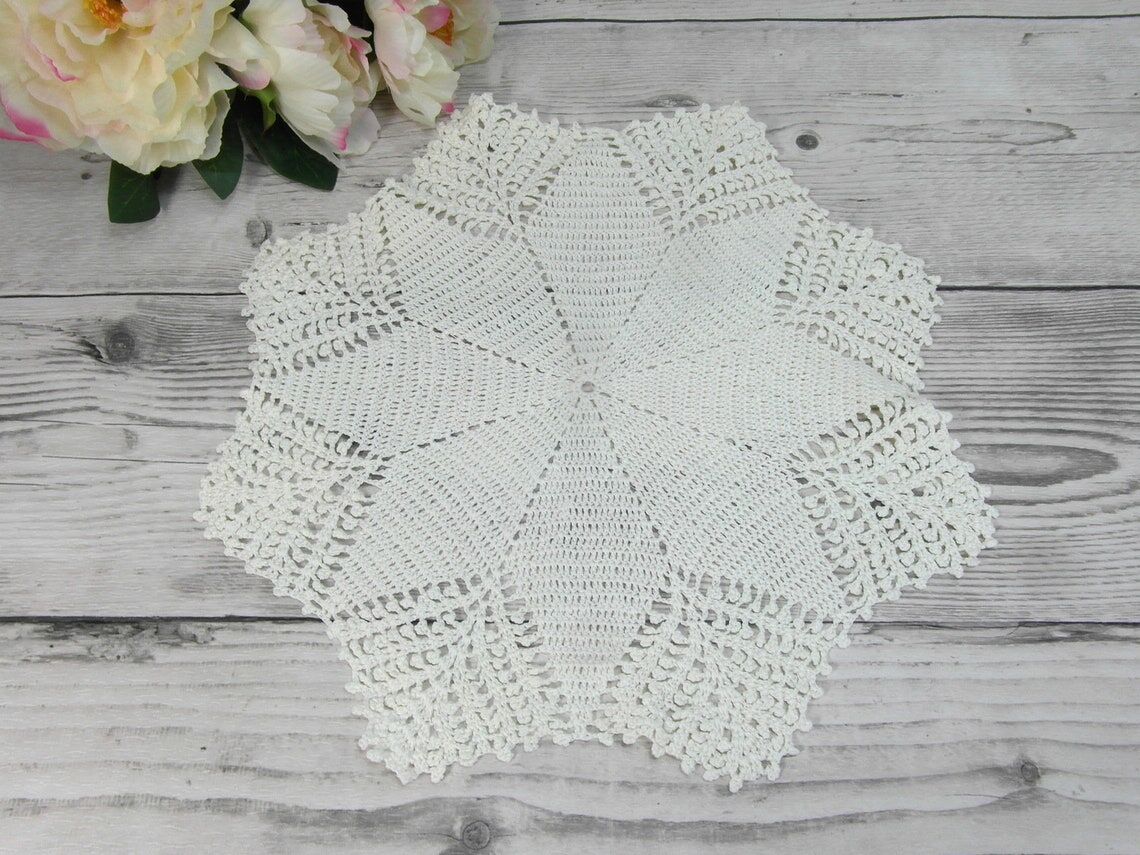 Handmade round placemat in crocheted cotton lace